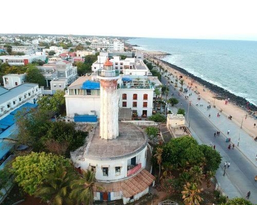aerial view of city buildings near body of water during daytime