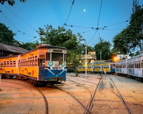 yellow and white tram on road during daytime